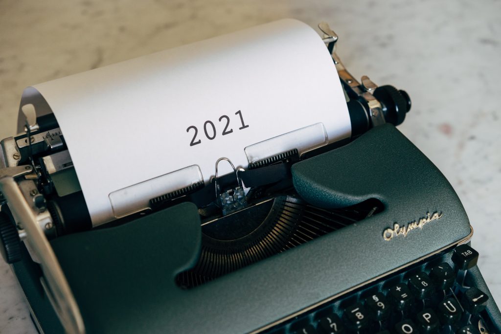 Typewriter with 2021 written on paper. Building brand awareness of Christian websites. 